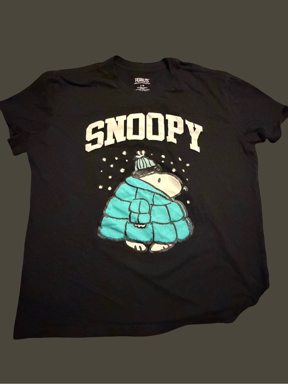 Peanuts woman’s Black Tee with Teal Snoopy Puffer Graphic